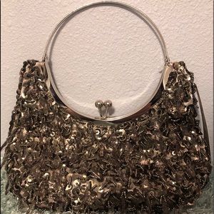 NWT Prezzo mink color silver tone handle clutch